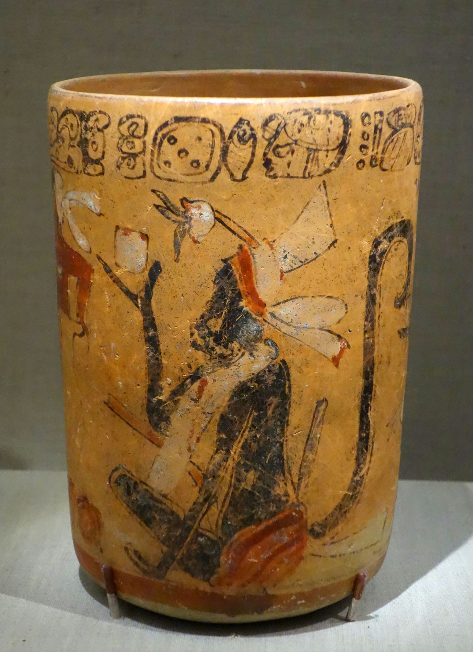 A painted Maya vase showing monkeys beside a cacao tree