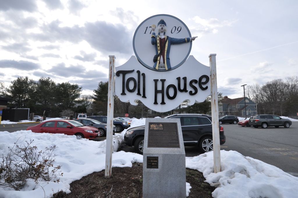 A roadside sign marking the site of the Toll House in Whitman, Massachusetts
